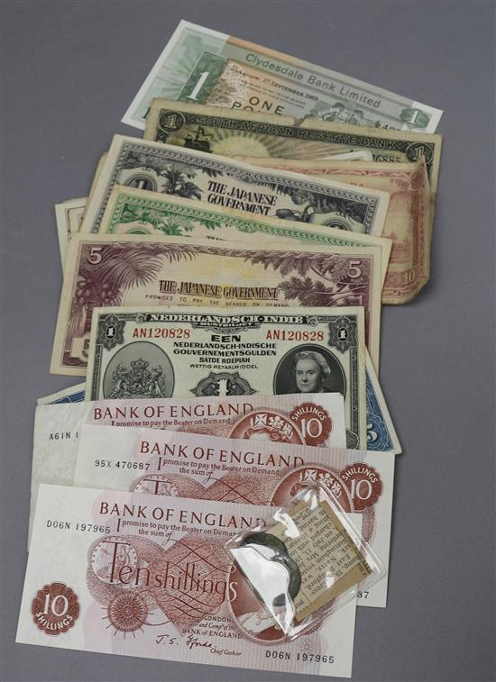 A group of assorted bank notes and two tokens
